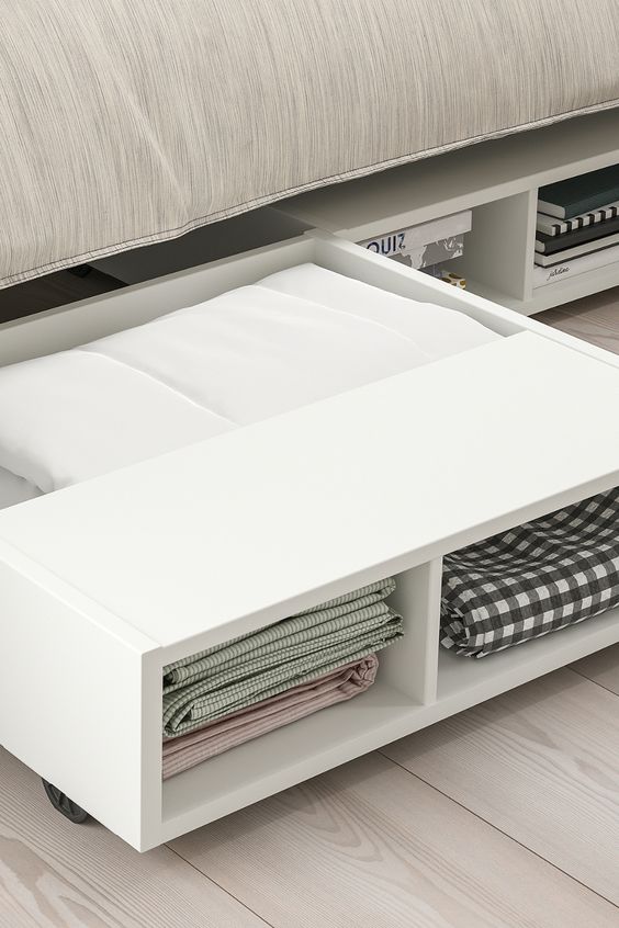 Close-up view of an under-bed storage drawer in a small bedroom, maximizing space with stylish organization.